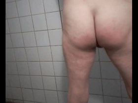 Amateur gay BDSM scene with spanking and slave play.