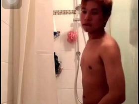 Steamy shower scene with a slim Asian man pleasuring himself.