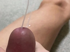 Close up and slow motion of an ejaculation while stroking off