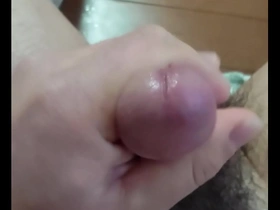 Gay Japanese man masturbates and releases a cum shot.