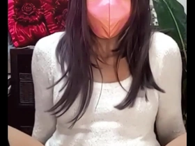 Beautiful Japanese ladyboy masturbates while live streaming.