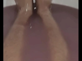 Asian beauty enjoys a slimy bath with bare feet