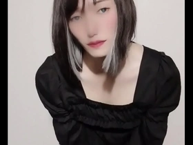 Cross-dressing Japanese sissy femboy in erotic video
