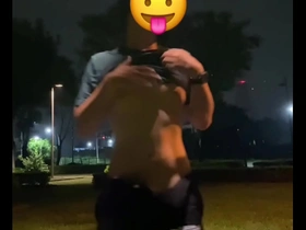 Young man masturbates on a public bike and ejaculates on the street.