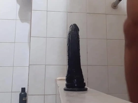 Gay man pleasuring himself with a new dildo