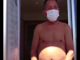 Gay Japanese man gives a handjob