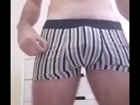 Young gay guy masturbates and talks dirty while hidden camera films him.
