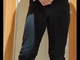An Asian gay man masturbates with a dildo in a public restroom.