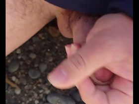 Gay Japanese man masturbates outdoors and has an orgasm
