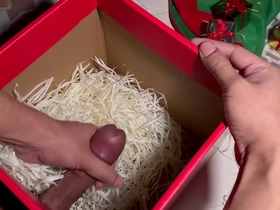 Gay Asian man unboxes Santa’s gift and pleases himself.