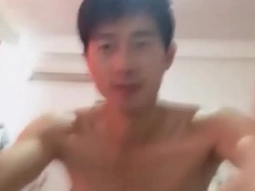 A young gay man masturbates and ejaculates.