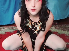 CrossdresserKitty, a popular YouTube star, in a MILF dress showing off his big ass.
