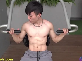 Fitness enthusiast flaunting his muscles and well-toned body outdoors.