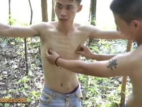 Asian boy tied up and abused outdoors in a hardcore scene