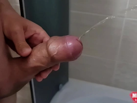 Golden shower with a horny cock and a happy ending